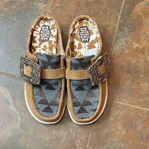 Hey Dude woman’s Tan and Gray Slip-On mules with Decorative Buckle